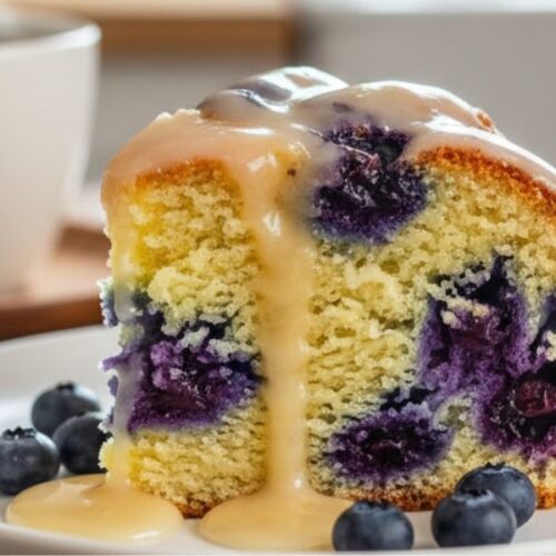 Sliced: “Sliced blueberry pound cake with lemon glaze served with coffee”