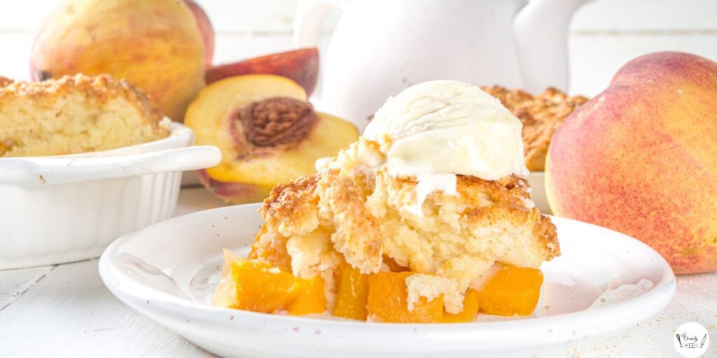 Warm peach cobbler served with a scoop of vanilla ice cream on top