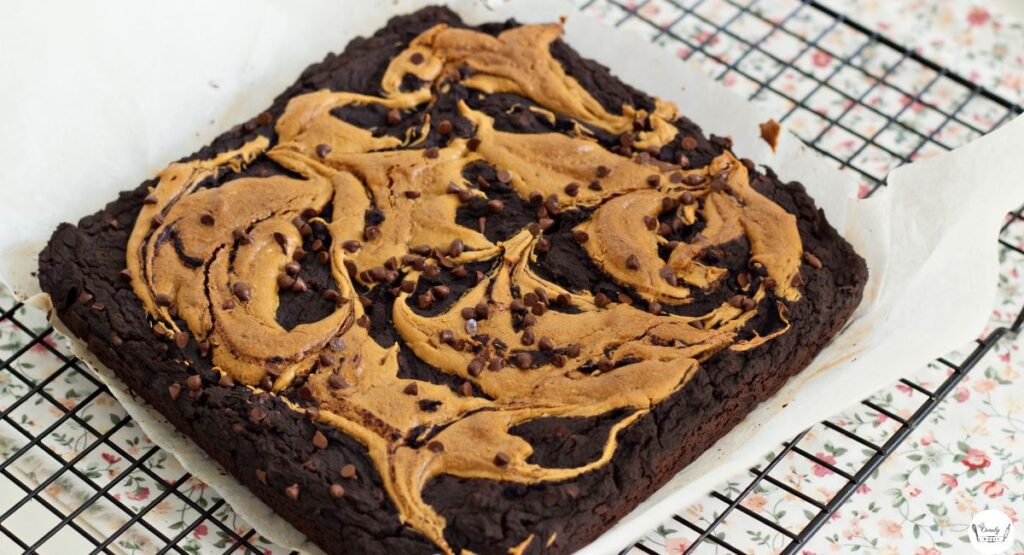 Freshly baked peanut butter brownies cooling in a pan