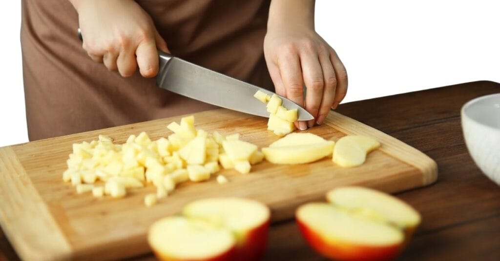 Chopped apples in a pot ready to cook for cinnamon applesauce