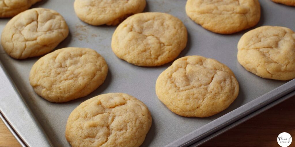 Golden brown 3 ingredient sugar cookies cooling after baking – easy sugar cookie recipe