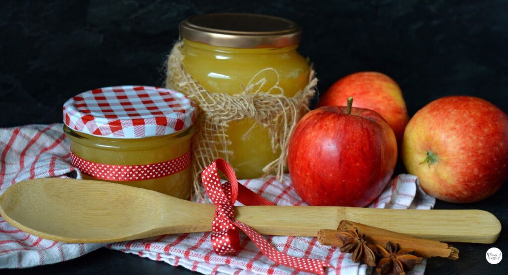 Homemade cinnamon applesauce stored in glass jars for serving or storage