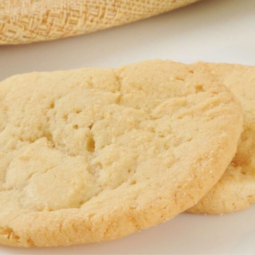 Freshly baked 3 ingredient sugar cookies stacked on a plate – easy homemade sugar cookie recipe