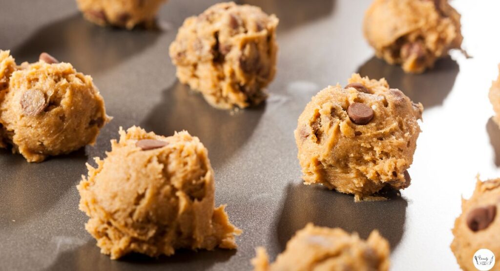 Almond flour cookie dough on parchment paper before baking