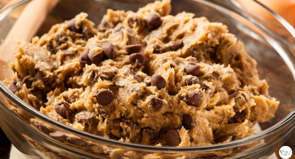 Cookie dough mixture for almond flour chocolate chip cookies in a glass bowl