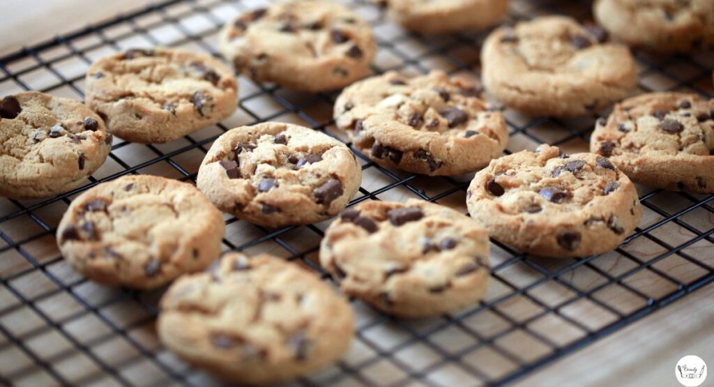Freshly baked almond flour chocolate chip cookies on cooling rack