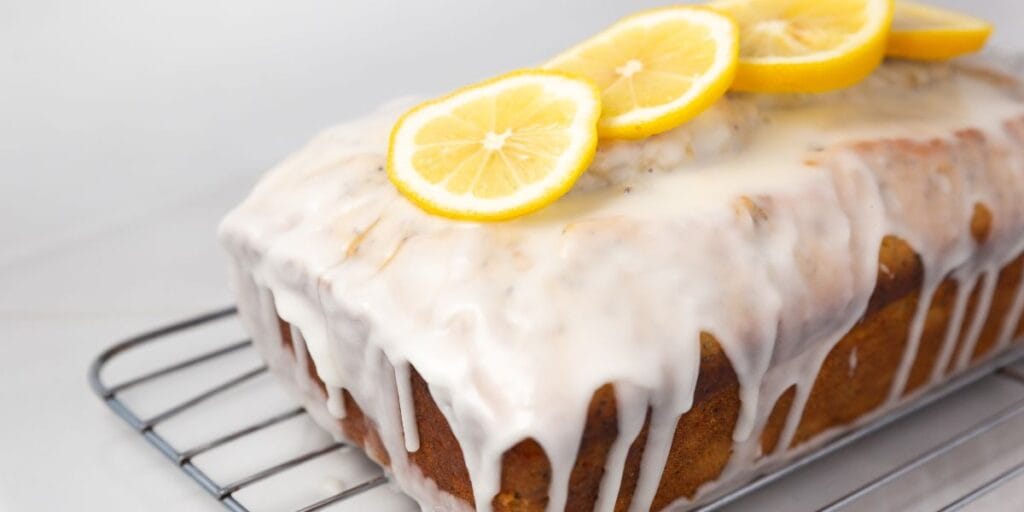 Baked lemon blueberry bread loaf cooling on a wire rack