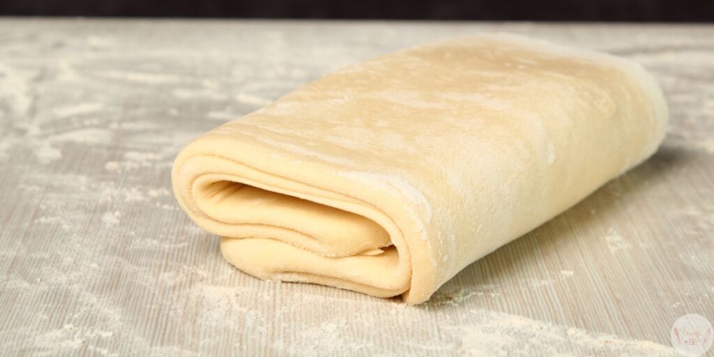 Filling puff pastry with cream cheese and guava paste for guava cheese pastries