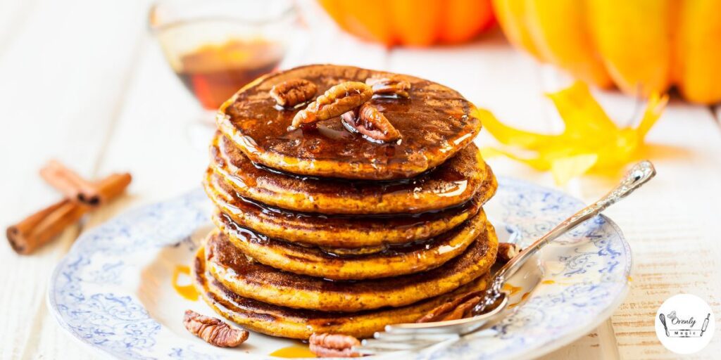 Fluffy Perkins pumpkin pancakes stacked with maple syrup and butter – perfect fall breakfast.