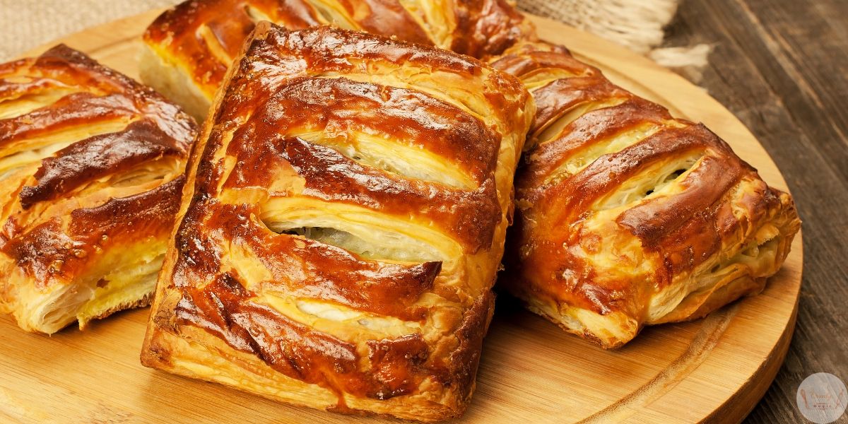 Freshly baked golden brown guava and cheese pastries with puff pastry