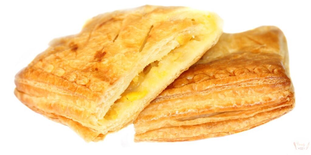 Freshly baked golden brown guava and cheese pastries with puff pastry