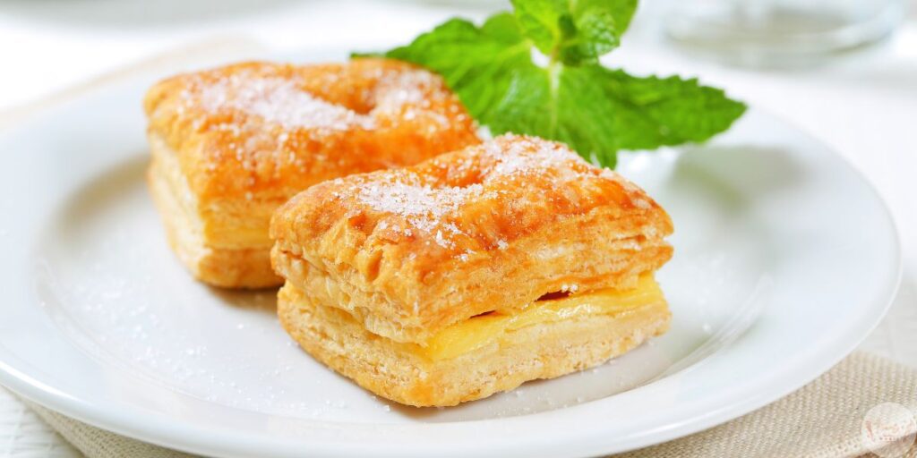 Freshly baked golden brown guava and cheese pastries with puff pastry