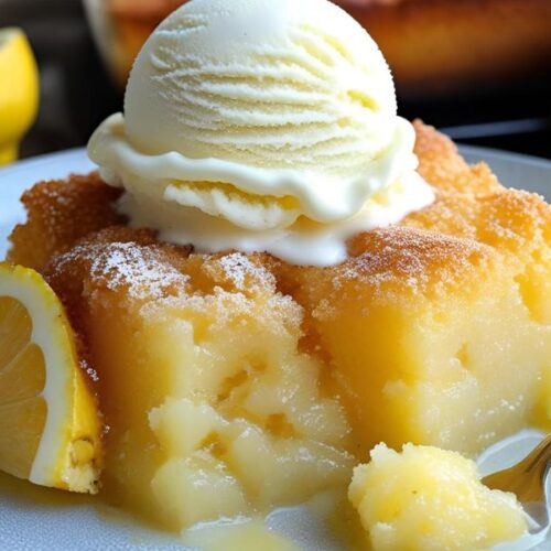 Freshly baked lemon pineapple dump cake served warm with a scoop of vanilla ice cream