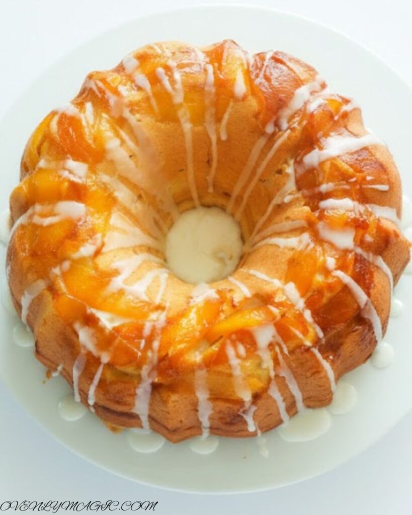  Soft peach cobbler pound cake topped with glaze