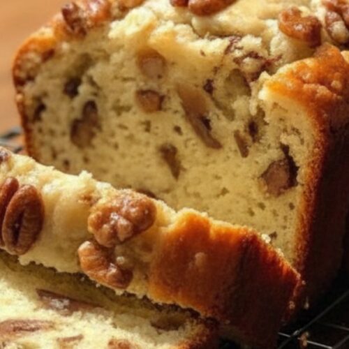 “Golden brown Sweet Alabama Pecan Bread cooling on wire rack, slices showing soft buttery texture with crunchy pecans, southern bread recipe”