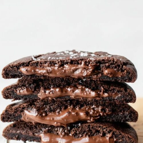 Soft and gooey Nutella Chocolate Lava Cookies on a baking tray, molten chocolate center visible