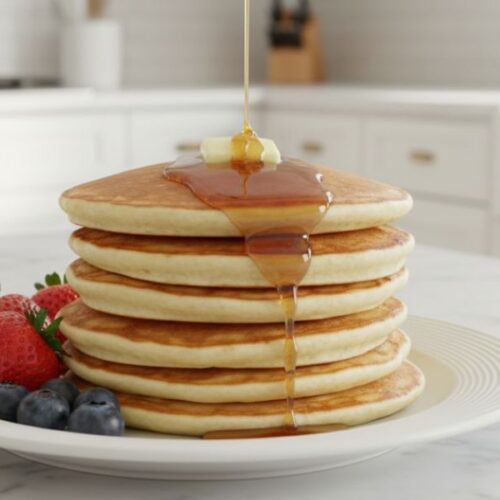 Fluffy Perkins pancake recipe with butter and syrup in luxury white kitchen