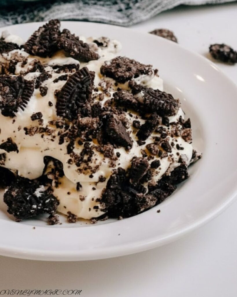 Layered Oreo Dirt Pudding with Cool Whip and fun toppings