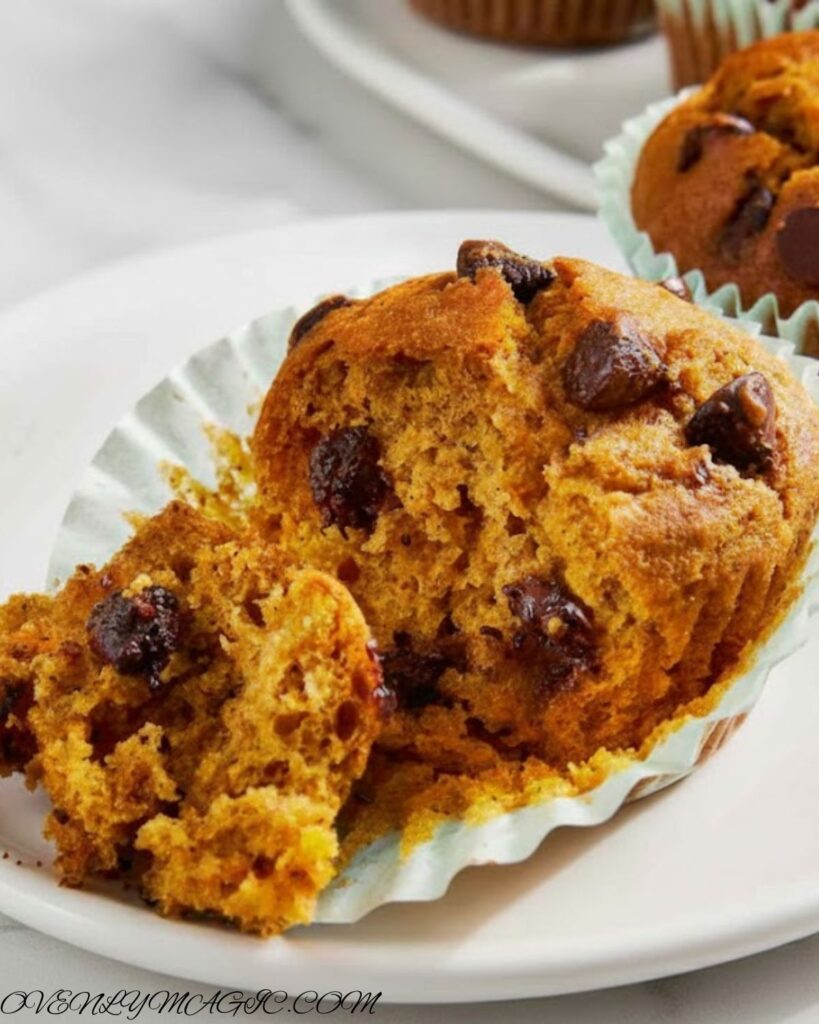 Soft and fluffy pumpkin chocolate chip muffins on a cooling rack
