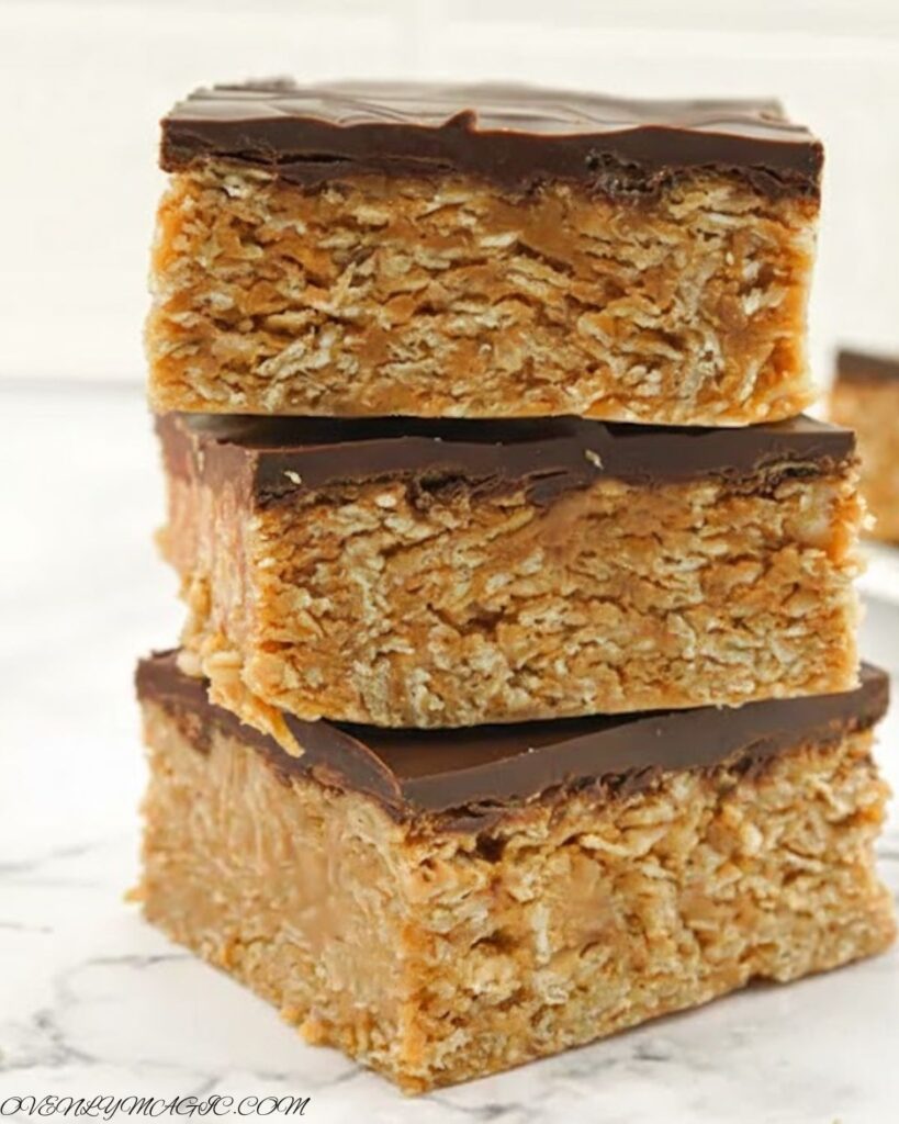 Chewy No Bake Peanut Butter Oat Bars sliced into squares with gooey chocolate topping
