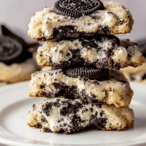 Close-up of a stuffed Oreo cheesecake cookie showing soft center filling