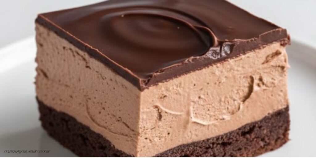 Fudgy chocolate mousse brownies in an 8x8 pan with ganache topping