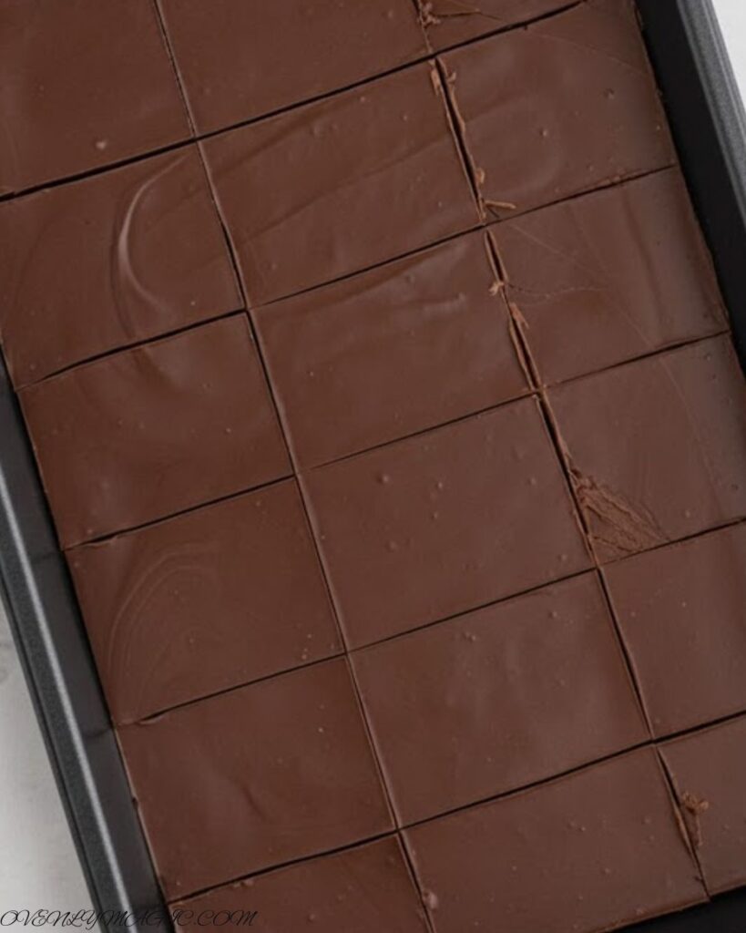 No-Bake Peanut Butter Bars chilling in the refrigerator to set the chocolate topping