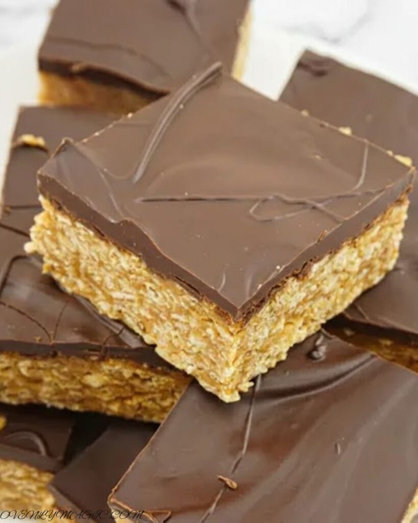 No-Bake Peanut Butter Oat Bars chilling in the refrigerator before slicing