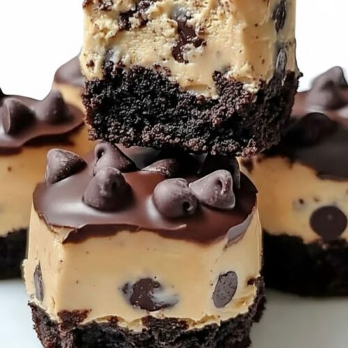 Serving chocolate chip cookie dough brownie bites on a plate for parties