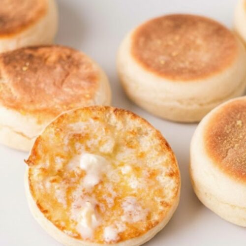 Split English Muffins toasted, with butter, jam, or eggs — breakfast-ready setup.