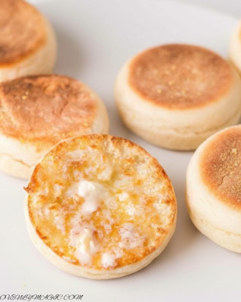 Split English Muffins toasted, with butter, jam, or eggs — breakfast-ready setup.