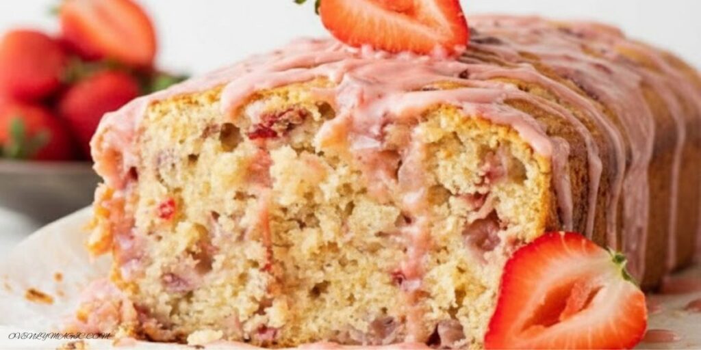 Slice of moist strawberry banana bread showing soft crumb and strawberry pieces