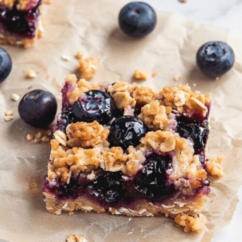 Freshly baked blueberry oatmeal bars with golden edges