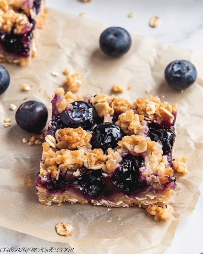 Freshly baked blueberry oatmeal bars with golden edges