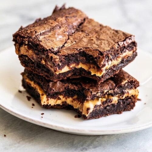 Homemade peanut butter stuffed brownies served on a plate