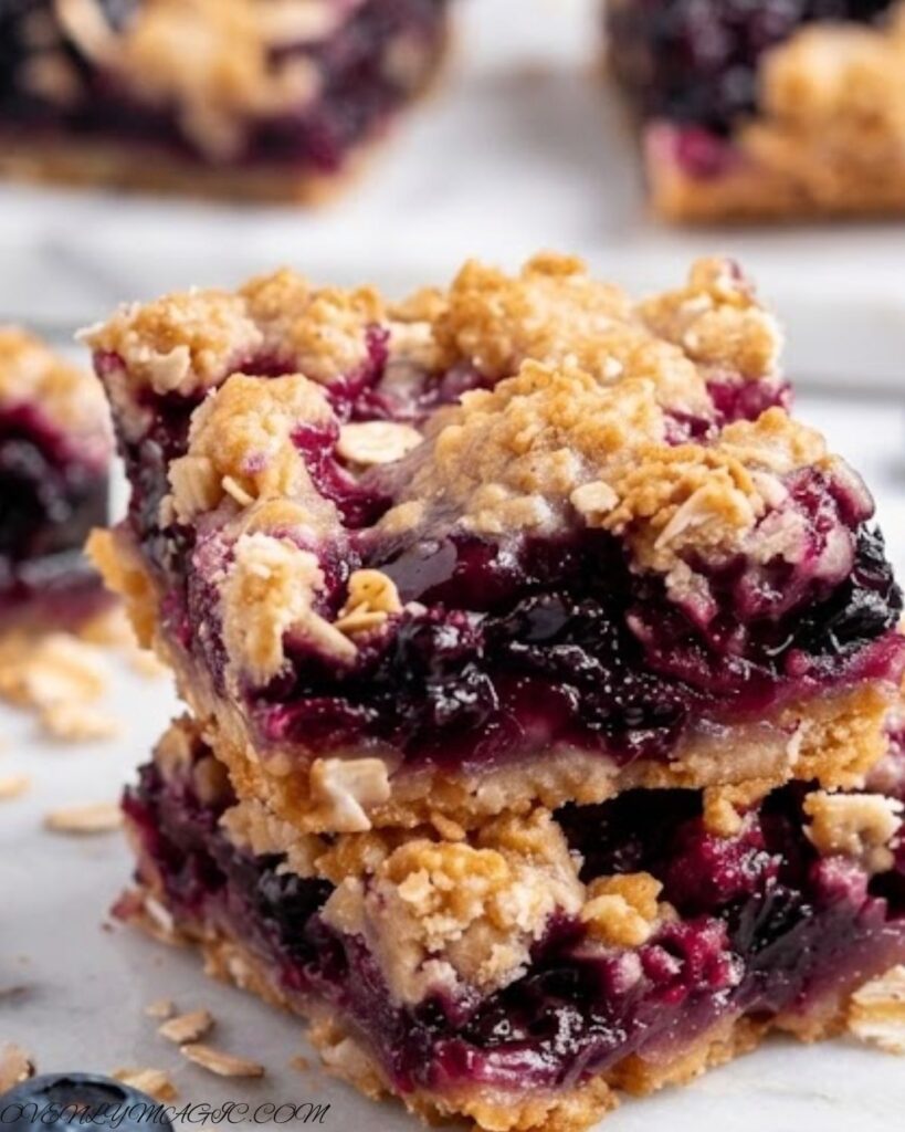 Freshly baked blueberry oatmeal bars with golden edges